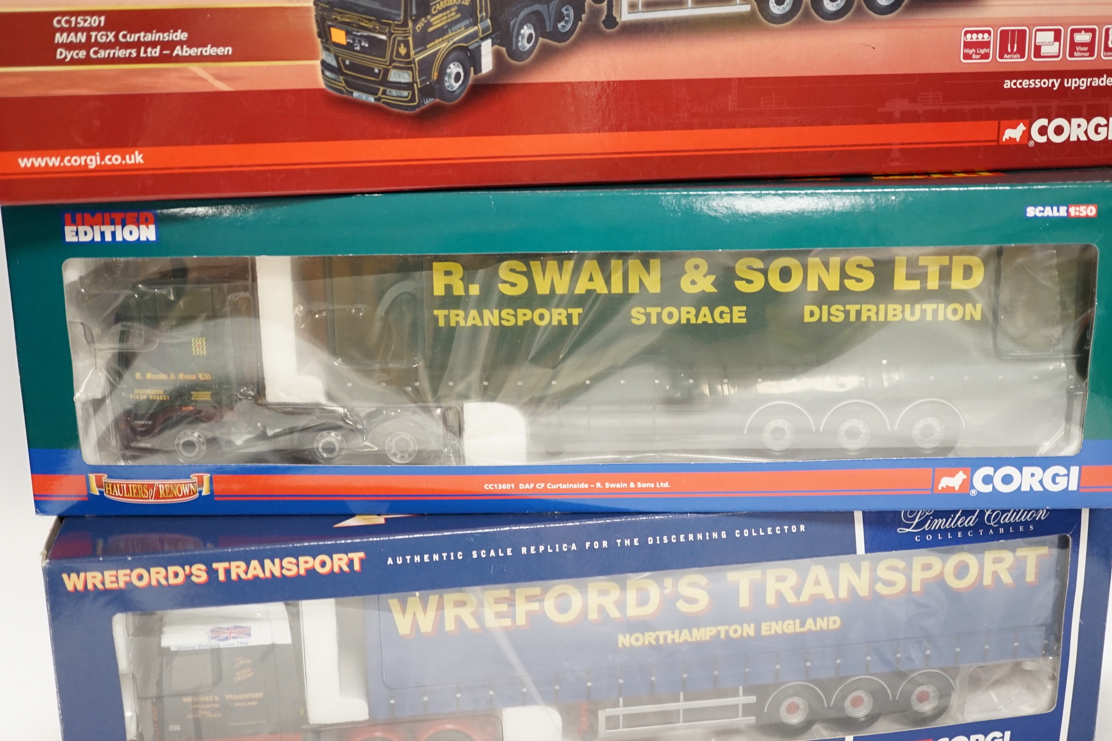 Four boxed Corgi 1:50 scale articulated trucks; a DAF CF curtainside (CC13601), a Volvo FM with box trailer (CC13506), a DAF XF Space Cab curtainside (CC13216), and a MAN TGX curtainside (CC15201)